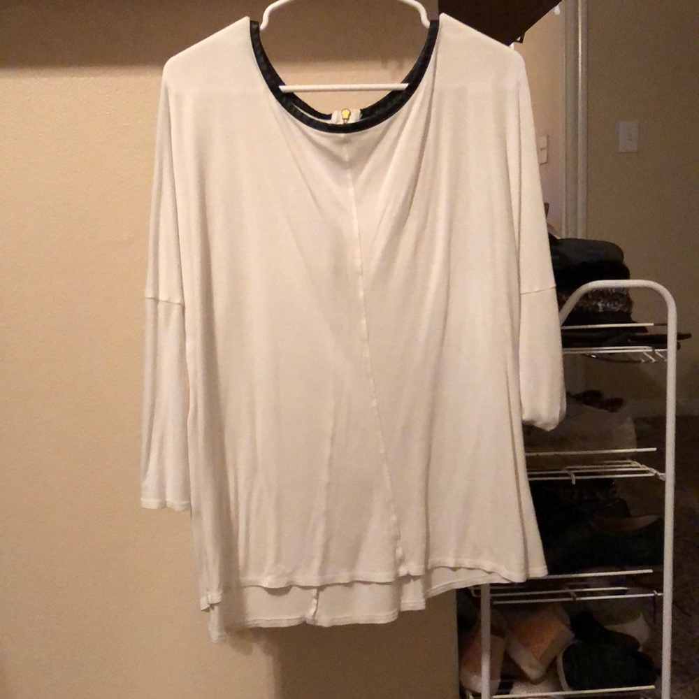 It’s a long/mid arm length sleeve top